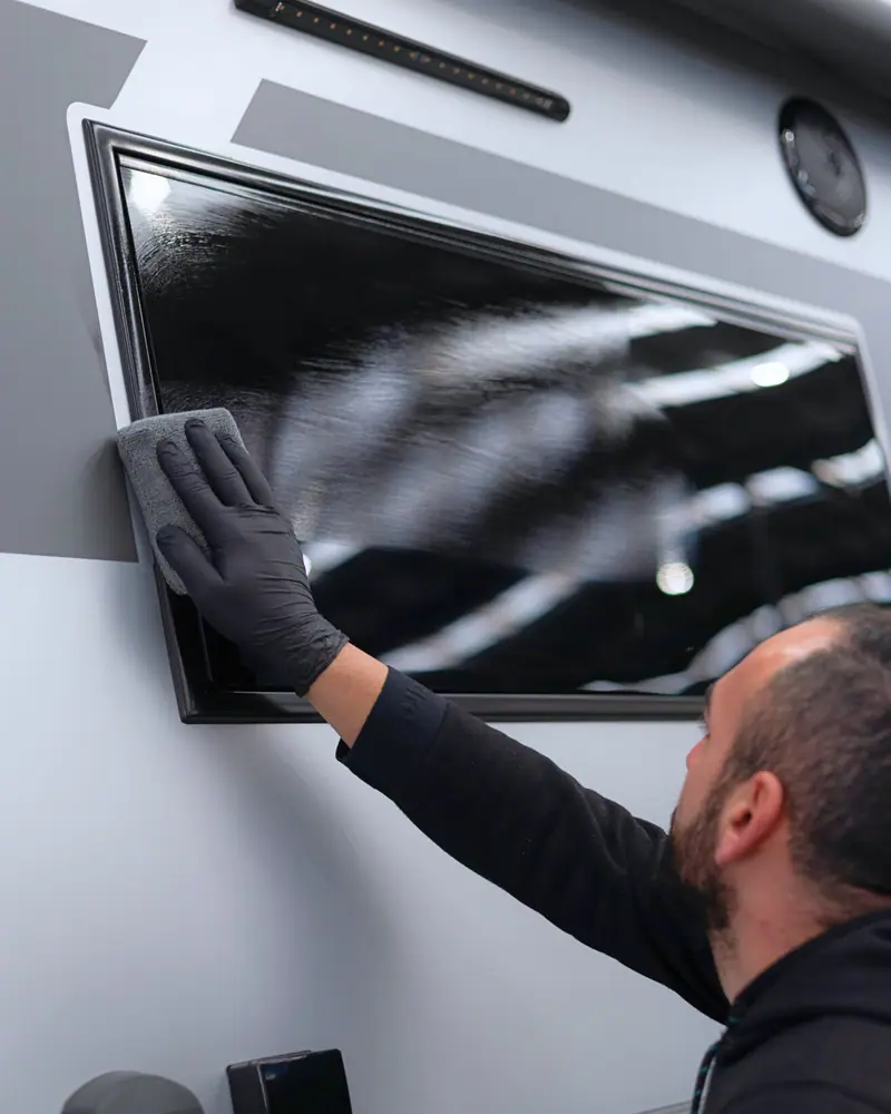 OzoneShield technician coating a caravan window