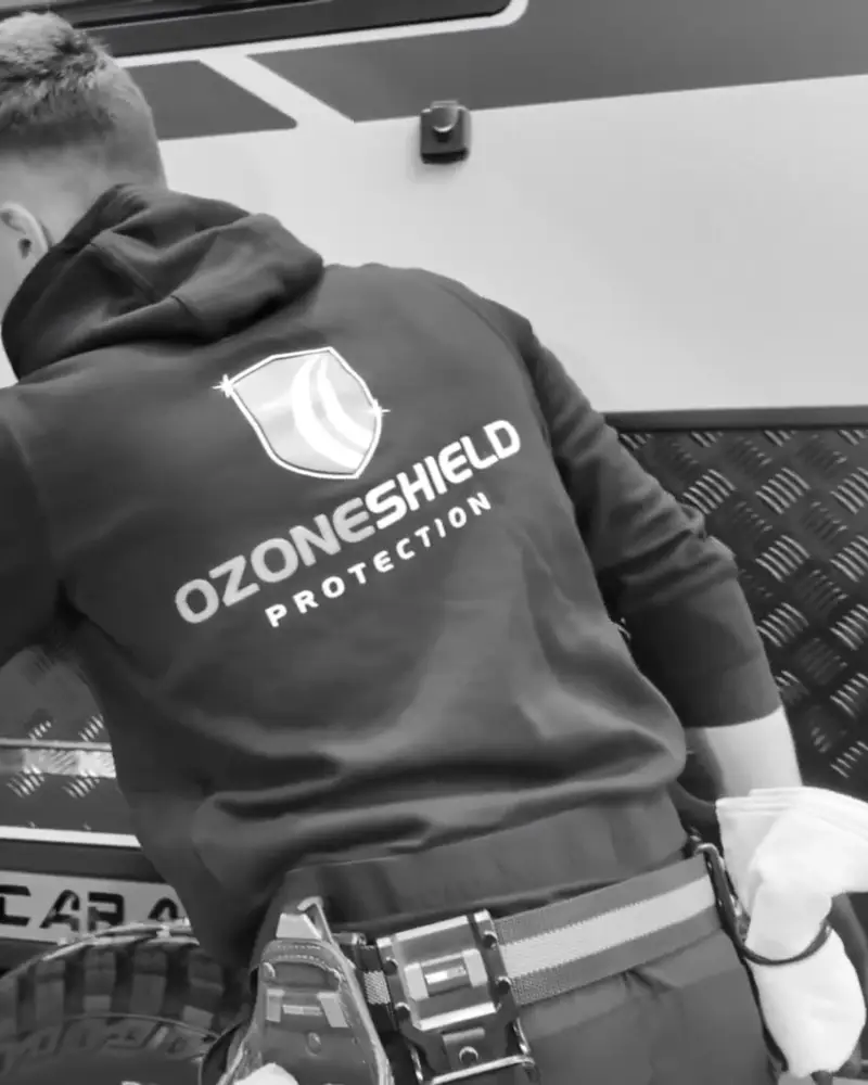 OzoneShield technician applying ceramic coating to a caravan